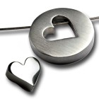 Two-part round pendant made of stainless steel, heart element inside