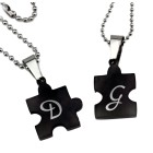Partneranhänger "Puzzle mit Herzmotiv auf der Vorderseite" aus Edelstahl PVD schwarz beschichtet mit individueller Gravur auf d